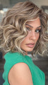 Model is wearing ROMANTIC RENAISSANCE by RAQUEL WELCH in color SS12/22 SHADED CAPPUCCINO | Light Golden Brown Evenly Blended with Cool Platinum Blonde Highlights and Dark Roots