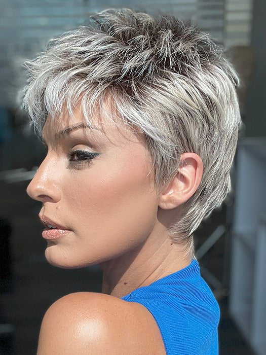 Model is wearing CHAT by ELLEN WILLE in color PEARL ROOTED | Pearl Platinum with Medium Ash Blonde and Lightest Brown with Grey Blend and Shaded Roots
