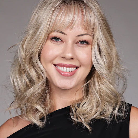 Model is wearing SIMONE in color BUTTERBEER R | Dark Brown Base and Root that transitions smoothly into a buttery blonde, infused with creamy honey and toffee tones