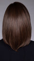 Model is wearing STREISAND in SOFT AMBER BROWN R | A warm rooted, amber-toned shade blending golden and red hues over a medium brown base.