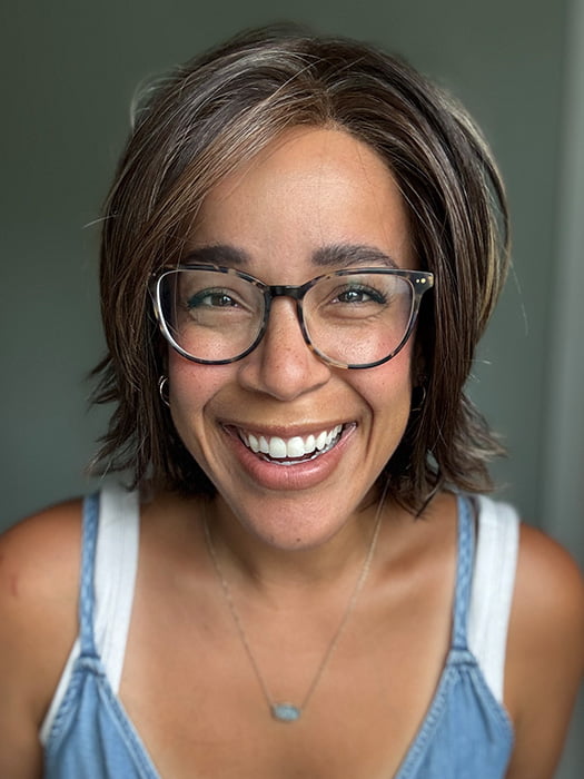 Brea @getwiggywithbrea is wearing SEVILLE by BELLE TRESS in color DARK BROWN HL | A Blend of Dark Brown, Strawberry Light Auburn and Soft Chunky Medium and Dark Blonde Highlights.