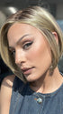 Model is wearing SHELBY by JON RENAU in color 24BT18S8 SHADED MOCHA | Medium Natural Ash Blonde & Light Natural Gold Blonde Blend, Shaded with Medium Brown
