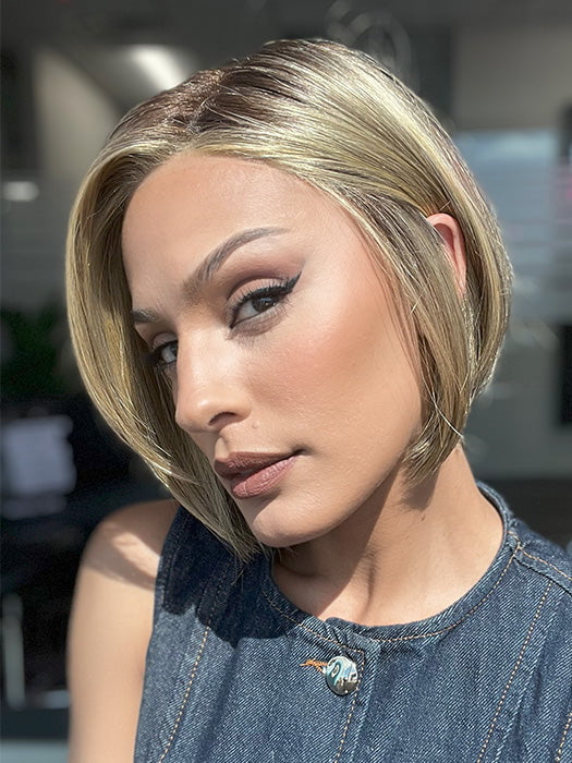 Model is wearing SHELBY by JON RENAU in color 24BT18S8 SHADED MOCHA | Medium Natural Ash Blonde & Light Natural Gold Blonde Blend, Shaded with Medium Brown