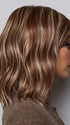 Model is wearing SMOOTH WAVEZ in color SNOWY UMBER R | Medium Ginger Brown base with White Blond highlights