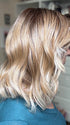 Eileen @crazywiglady is wearing SMOOTH WAVEZ by RENE OF PARIS in color MELTED-MARSHMALLOW | Subtly warm dark sandy blonde blend with medium brown roots and light ash blonde tips and highlights