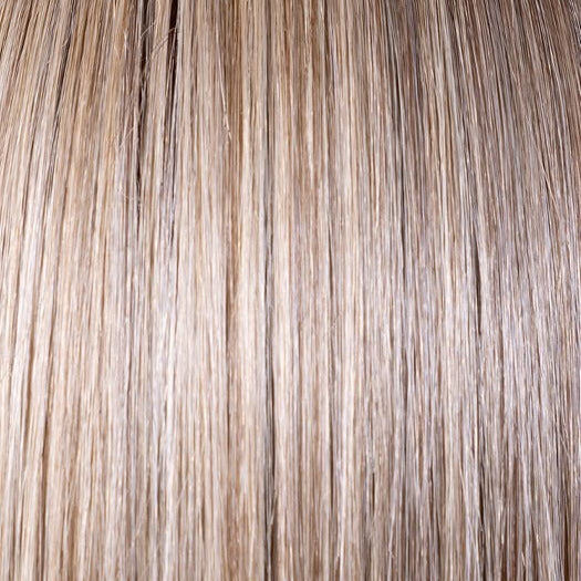 SPARKLING CHAMPAGNE R | Medium Ash Brown roots transition into Shimmering Champagne Blonde characterized by Pale Golden Hues with subtle Ivory and Platinum undertones reminiscent of a sparkling glass of bubbly