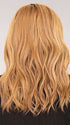 Sophia wearing Beach Wave Magic by TressAllure in color 14/26/R10 | Red Blonde with Gold Blonde highlights and Light Brown roots