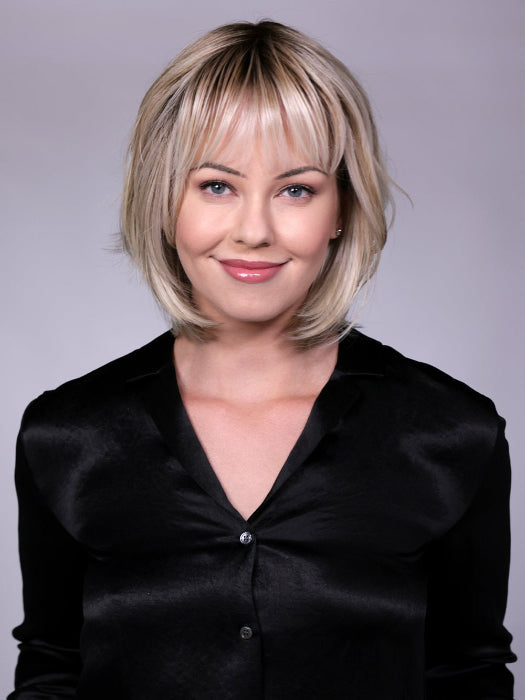 Model is wearing TRIBECA By BELLETRESS in CRUSHED-ALMOND-BLONDE-R | A Soft Neutral Light Blonde with a Light and Medium Blended Root Color