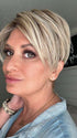 Emily H. @she_sheds_more wearing SAN FRANCISCO by BELLETRESS in color BEIGE LINEN BLONDE R | Neutral Beige Blonde mixed with Medium and Dark Blonde, Highlighted using Ash Blonde with Medium Brown Root color