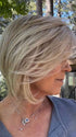 Susan @an_affair_with_hair wearing STRAIGHT UP WITH A TWIST by RAQUEL WELCH WIGS in color RL19/23 BISCUIT | Light Ash Blonde Evenly Blended with Cool Platinum Blonde

