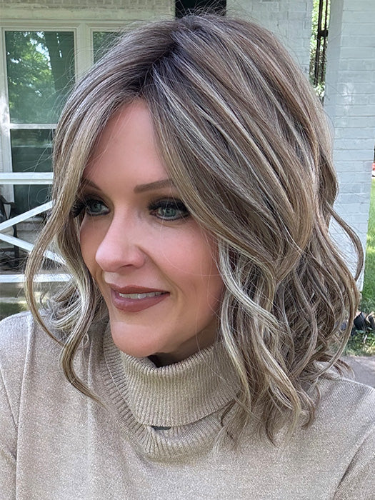 Marcie Mertz @wig.obsessed wearing WAVY DAY by RAQUEL WELCH in color RL12/22SS SHADED CAPPUCCINO | Light Golden Brown Evenly Blended with Cool Platinum Blonde Highlights with Dark Roots
