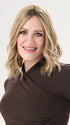 Model is wearing BARELY THERE WAVY 12" TOPPER in color PROSECCO | BROWN ROOTS WITH GOLDISH BLONDE HIGHLIGHTS