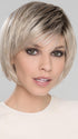 With soft layers that frame around the face. Edgy, with pieced out bangs and lots of personality