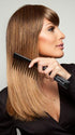 We recommend the Hair Trix Comb by BeautiMark to keep your hair detangled and frizz free (style shown is Lucy by Revlon).