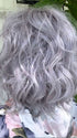 Marcie Mertz @wig.obsessed wearing BREEZY WAVEZ by RENE OF PARIS in color LUNAR-HAZE | Periwinkle Base with Off-Black Roots
