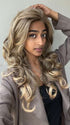 Shyla wearing BRIANNA by ENVY BY ALAN EATON in color FROSTED | Light Brown with Wheat Blonde blended highlights