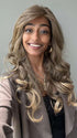 Shyla wearing BRIANNA by ENVY BY ALAN EATON in color FROSTED | Light Brown with Wheat Blonde blended highlights