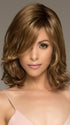 The Carrie Wig by Noriko is a medium length style that has a balanced body evoking a romantic quality sure to capture attention