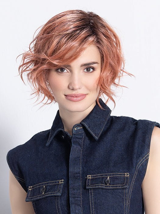 Model is in ROSE BLUSH ROOTED | Light copper, Peach, and Soft Rose Gold tones with subtle Golden Undertones and Shaded Roots