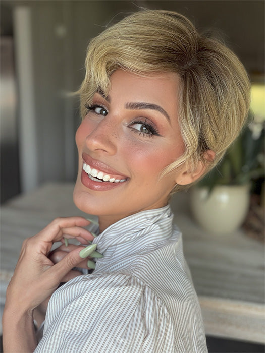 Roxie is wearing DEMI by JON RENAU in color 12FS8 SHADED PRALINE | Medium Natural Gold Blonde, Light Gold Blonde, Pale Natural Blonde Blend, Shaded with Dark Brown