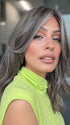 Model is wearing MAUDE by AMORE in color MUSHROOM-GREY-R |  Dark brown incorporates light brown and silvery grey tones with shadow roots for a stylish finish.