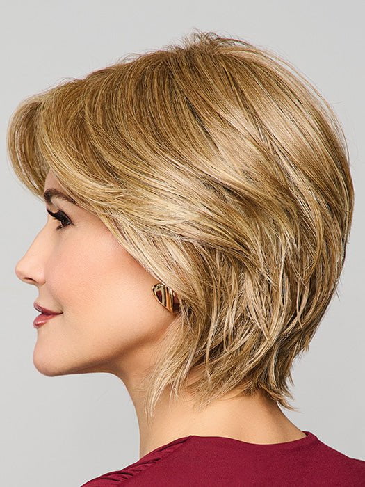 Model is wearing MAIN CHARACTER by RAQUEL WELCH in RL 13/88 GOLDEN PECAN | Neutral Medium Blonde With Pale Honey Blonde Highlight