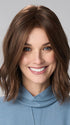 Model is wearing CHARLOTTE HAND TIED by ENVY in color MEDIUM BROWN | Medium Brown with natural highlights