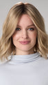 Model is wearing CHARLOTTE HAND TIED by ENVY in color PROSECCO (12/24/102R8)| Rooted Neutral Light Medium Blonde
