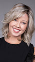 Model is wearing DONNA by BELLETRESS in color BUTTERBEER R | Dark Brown Base and Root that transitions smoothly into a buttery blonde, infused with creamy honey and toffee tones