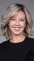 Model is wearing DONNA by BELLETRESS in color BUTTERBEER R | Dark Brown Base and Root that transitions smoothly into a buttery blonde, infused with creamy honey and toffee tones