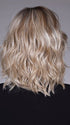 Model is wearing DONNA by BELLETRESS in color BUTTERBEER R | Dark Brown Base and Root that transitions smoothly into a buttery blonde, infused with creamy honey and toffee tones