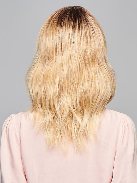 Model is wearing ASPIRATION by GABOR in color SS-LIGHT-BLONDE | Light Blonde with Golden Highlights & Dark Brown Roots