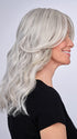 Model is wearing 16" AU NATUREL WAVES TOPPER by HAIRDO in color R56/60 SILVER MIST | Lightest Gray with 20% Medium Brown Evenly Blended with Pure White