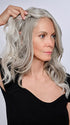 Model is wearing 16" AU NATUREL WAVES TOPPER by HAIRDO in color R56/60 SILVER MIST | Lightest Gray with 20% Medium Brown Evenly Blended with Pure White