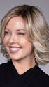 Model is wearing HELSINKI by BELLETRESS in color CRUSHED ALMOND BLONDE R | A soft Neutral Light Blonde with a Light and Medium Blended Root Color.