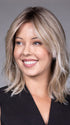 Model is wearing MONACO by BELLETRESS in color MILKSHAKE BLONDE R | A mixture of Light Sandy Brown, Highlighted with Light Ash Blonde with a Hint of Light Platinum Blonde with a Medium Root Color