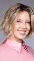 Model is wearing OSLO by BELLETRESS in color RAW SUGAR BLONDE | A Neutral Light Blonde, Honey Blonde, Pale Gold Blonde, with a base of Light Brown Lowlights featuring a Medium Root Color