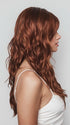 Model is wearing PHILLIPA by RENE OF PARIS in color CAFE ROUGE R | A dimensional auburn copper blend with rich reddish-brown roots melting into warm copper highlights