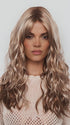 Model is wearing PHILLIPA by RENE OF PARIS in color WINTER OAT LATTE R | rooted honey blonde and platinum blonde blend with soft, dimensional highlights and lowlights