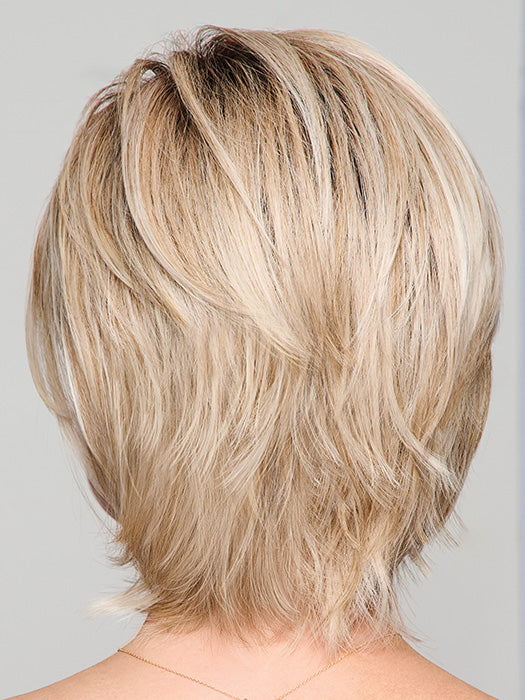 Model is wearing BOUTIQUE CHIC by RAQUEL WELCH in RL19/23SS SHADED BISCUIT | Light Ash Blonde Evenly Blended with Cool Platinum Blonde with Dark Roots