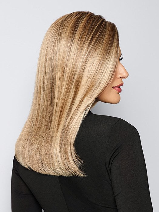 Model is wearing BOX OFFICE BEAUTY by RAQUEL WELCH in color SS1621 SHADED SAND | Light Blonde shaded with Medium Brown