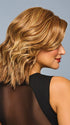 Model is wearing STEAL THE SHOW by RAQUEL WELCH in color RL29/25 GOLDEN RUSSET | Ginger Blonde Evenly Blended with Medium Golden Blonde