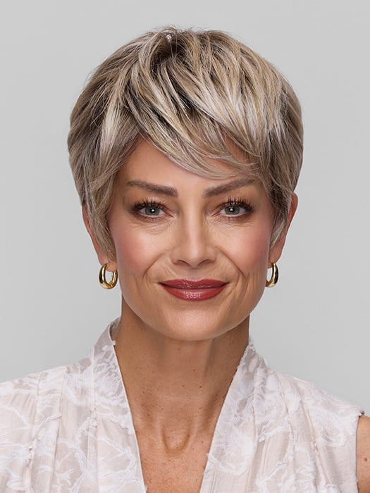 Model is wearing TESS by JON RENAU in color FS17/101S18 PALM SPRINGS BLONDE | Light Ash Blonde with Pure White Natural Violet Bold Highlights, Shaded with Dark Natural Ash Blonde
