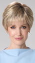 Model is wearing TIFFANY HAND TIED by ENVY in color SILKY BEIGE | Light Platinum Blonde with Dark Brown Roots