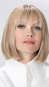 Model is wearing MISS COMFORT by ELLEN WILLE in color SANDY BLONDE ROOTED 16.22.20 | Medium Blonde, Light Neutral Blonde, and Light Strawberry Blonde Blend with Shaded Roots