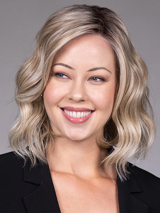 Model is wearing VERONICA in Butter Beer R | Dark Brown Base and Root that transitions smoothly into a buttery blonde, infused with creamy honey and toffee tones