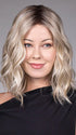 Model is wearing ANDIE in color BUTTER BEER R | A rich blend of warm brunette and golden honey highlights finished with a soft, natural root.