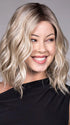 Model is wearing ANDIE in color BUTTER BEER R | A rich blend of warm brunette and golden honey highlights finished with a soft, natural root.
