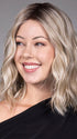 Model is wearing ANDIE in color BUTTER BEER R | A rich blend of warm brunette and golden honey highlights finished with a soft, natural root.