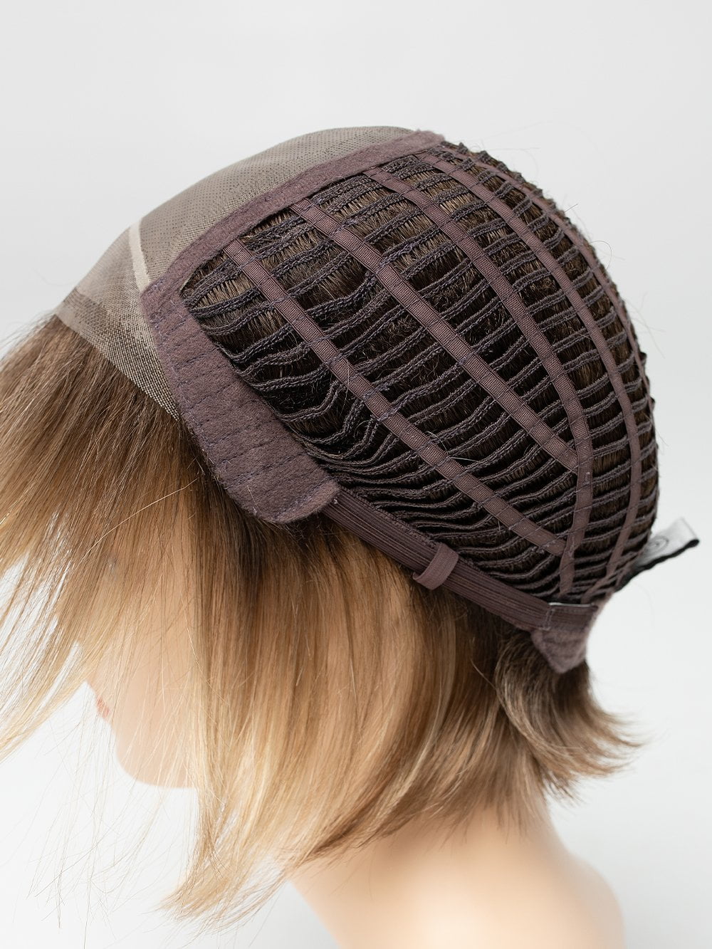 Fine nylon mesh with individual hairs hand-tied into the mesh